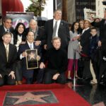 Lucho Gatica posing with other people in the Hollywood Walk of Fame